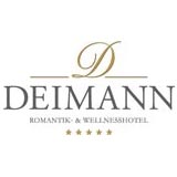 Logo for Deimann Romantic & Wellness Hotel with a gold decorative 'D' above the name DEIMANN and five stars below.