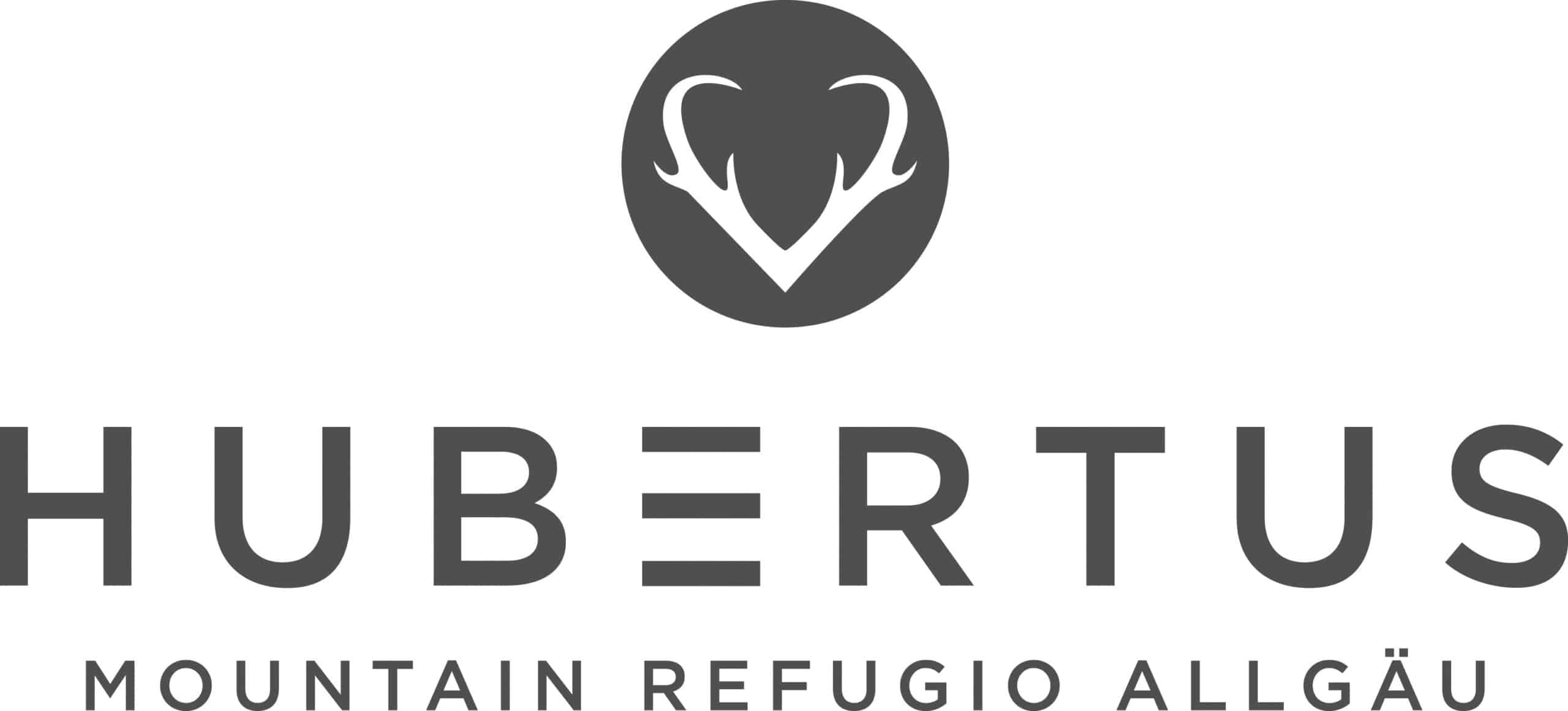 Hubertus Mountain Refuge Allgäu logo: a dark circle with white deer antlers above the word HUBERTUS and the subtitle 'MOUNTAIN REFUGIO ALLGÄU'